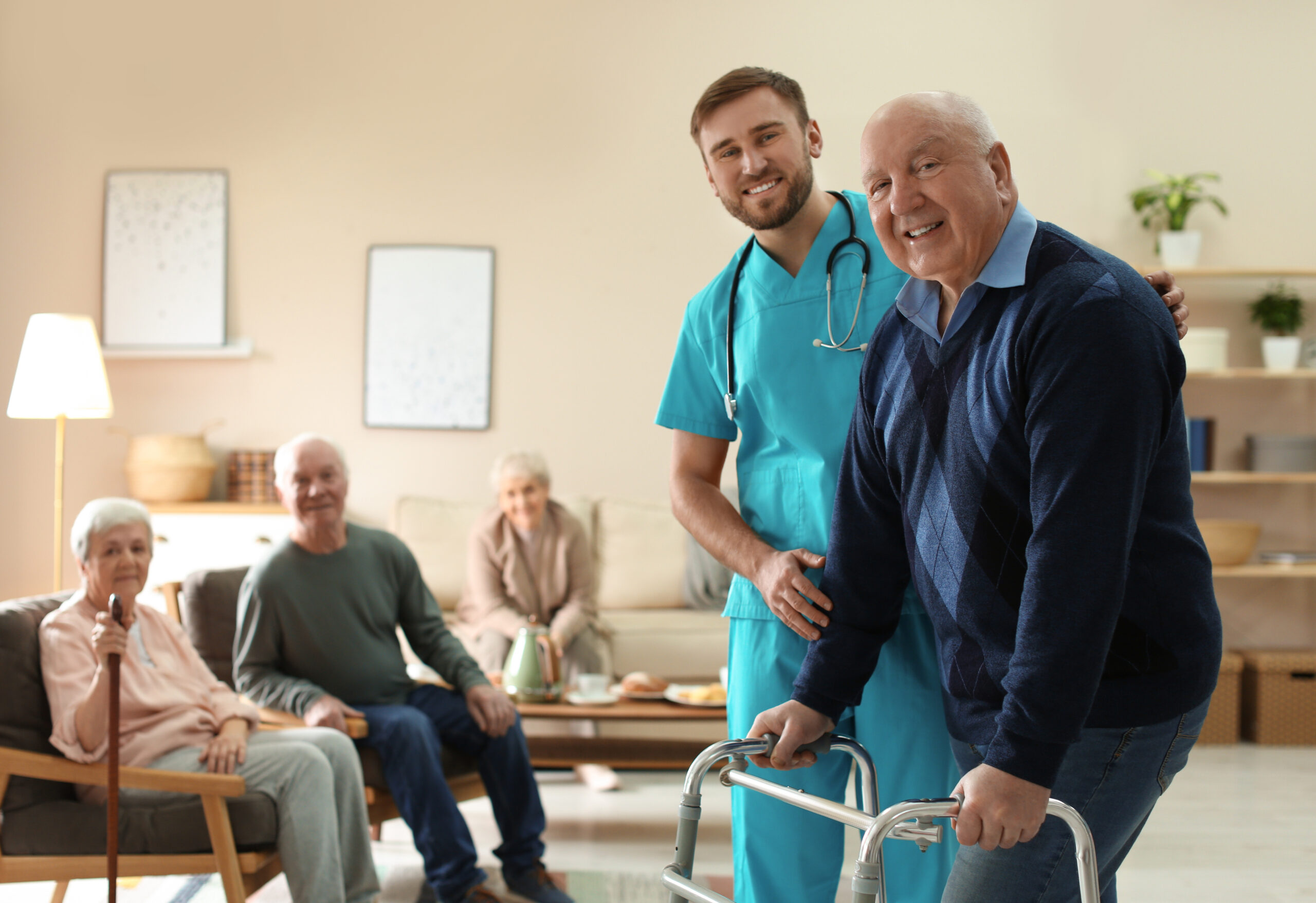Caregiver helping an older adult walk safely with a walker
